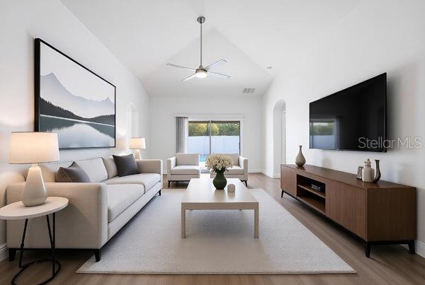 10120 Ives Loop Hudson, FL 34667 - Photo 8 of 23 a living room with furniture and a flat screen tv