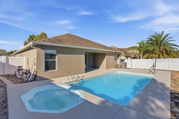 10120 Ives Loop Hudson, FL 34667 - Photo 10 of 23 a view of a house with patio