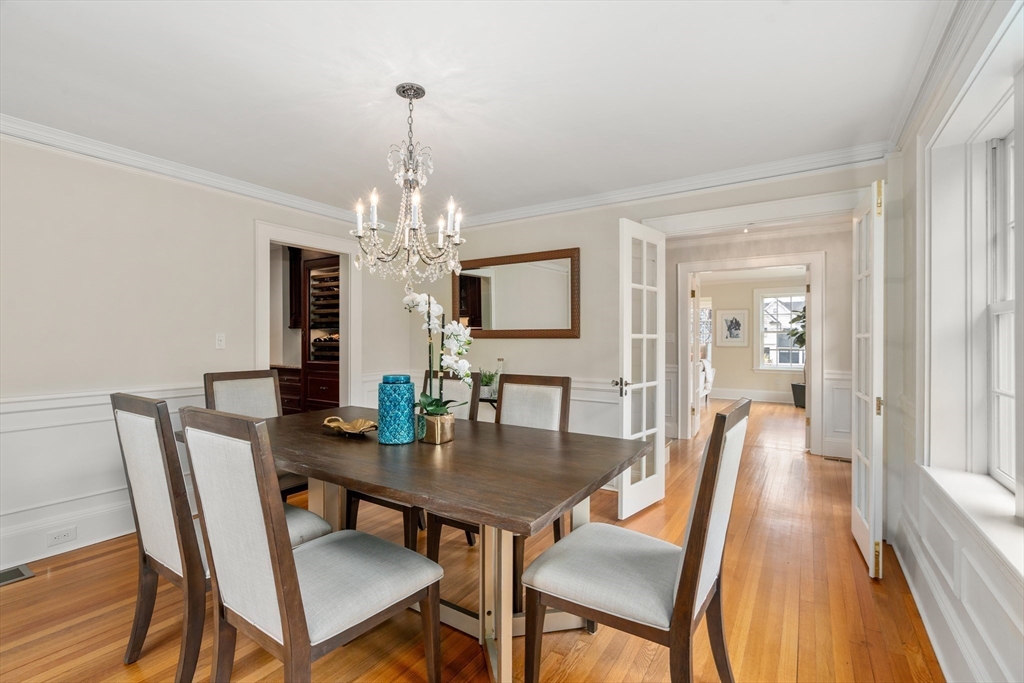 19 Kelveden Road Newton, MA 02468 - Photo 8 of 41 a view of a dining room with furniture a chandelier and wooden floor