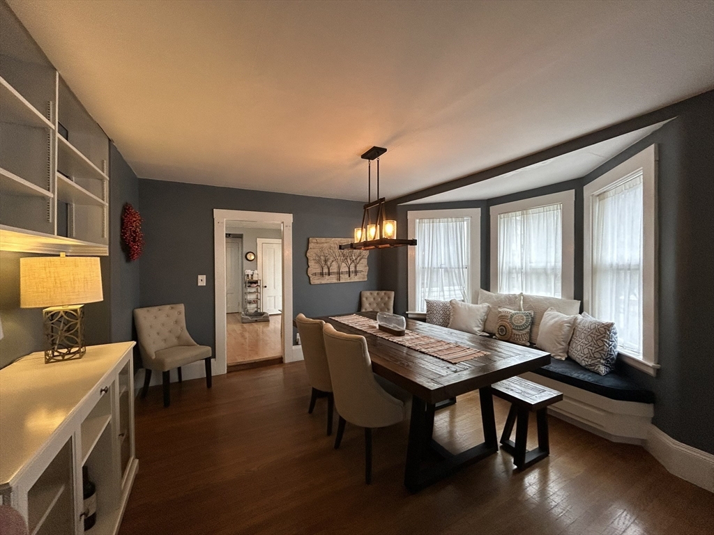 32 Parker Street, Unit 1 Lexington, MA 02421 - Photo 5 of 20 a view of a dining room with furniture window and wooden floor