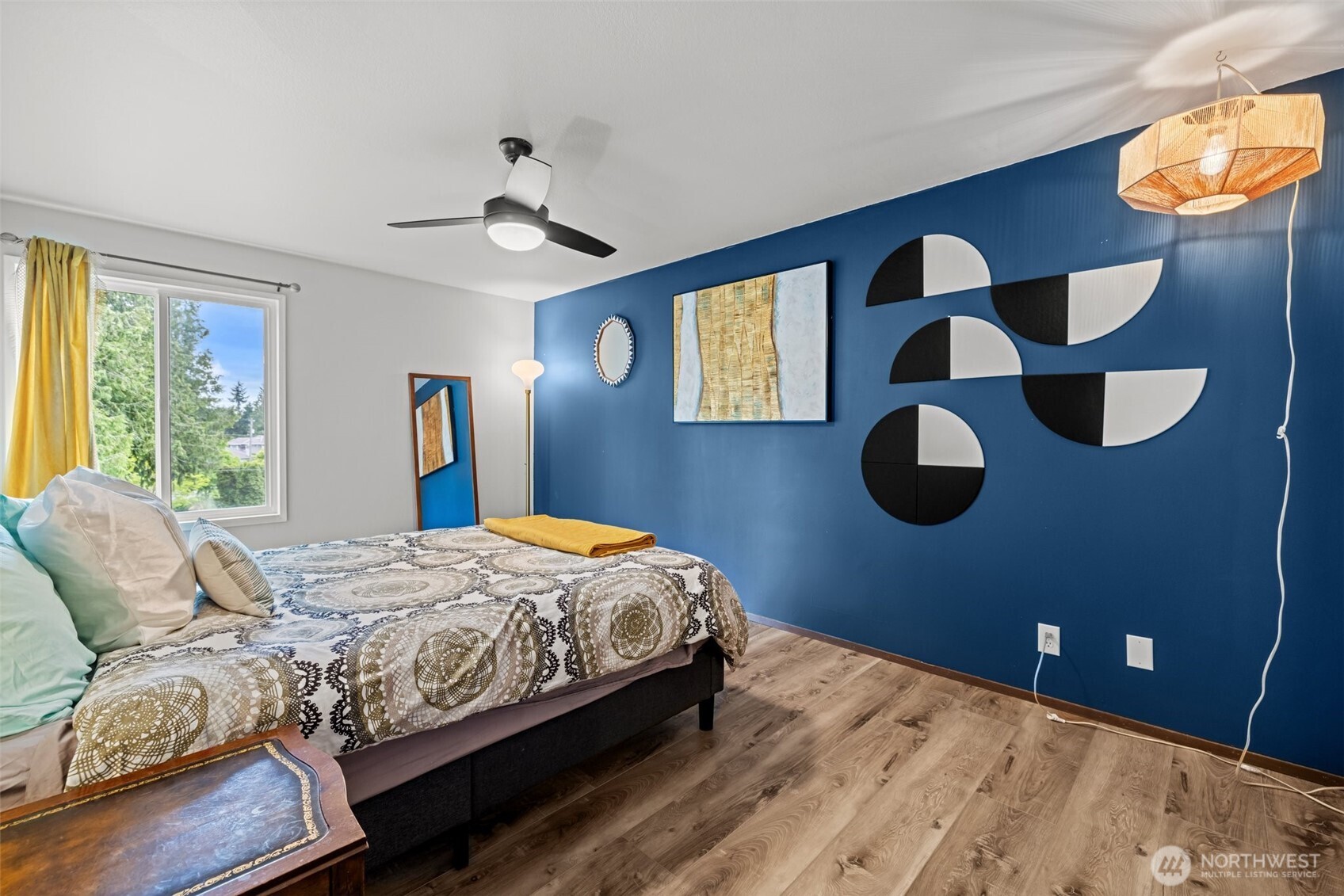 8516 196th Street Southwest, Unit 311 Edmonds, WA 98026 - Photo 14 of 28 a bedroom with a bed and cabinets