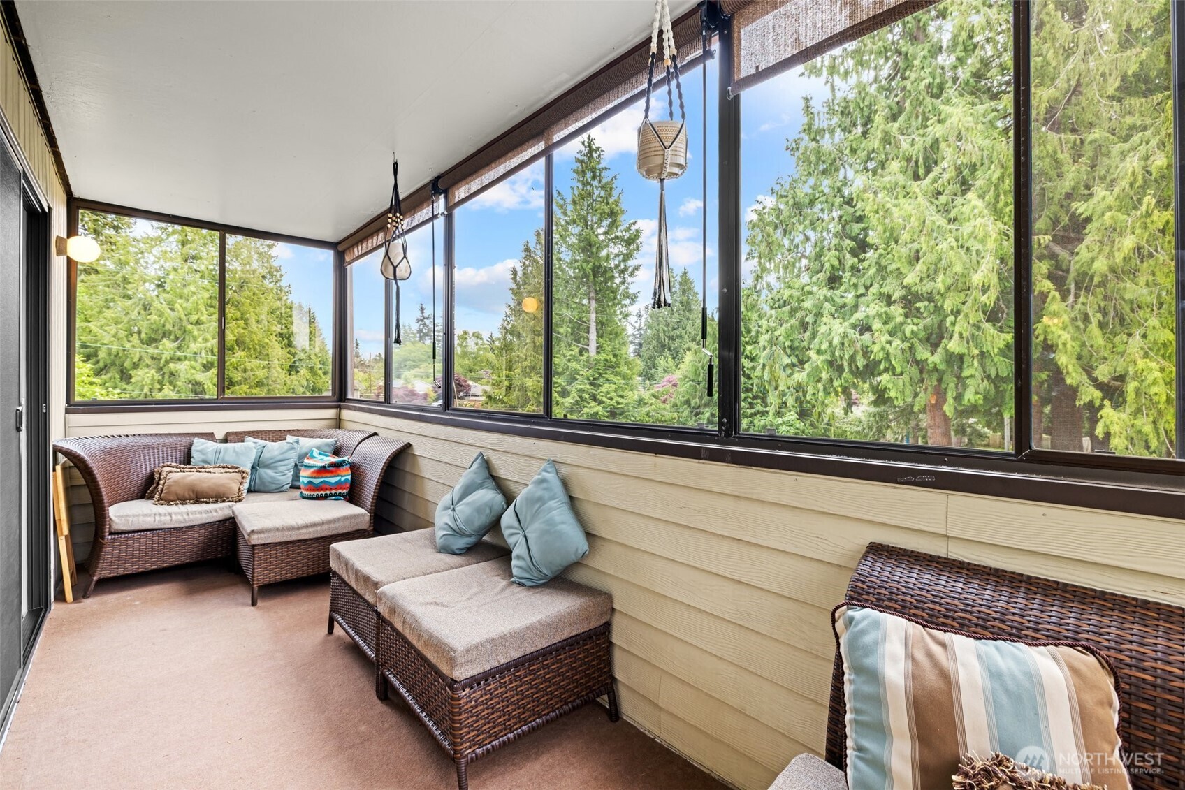 8516 196th Street Southwest, Unit 311 Edmonds, WA 98026 - Photo 20 of 28 a living room with furniture and a floor to ceiling window