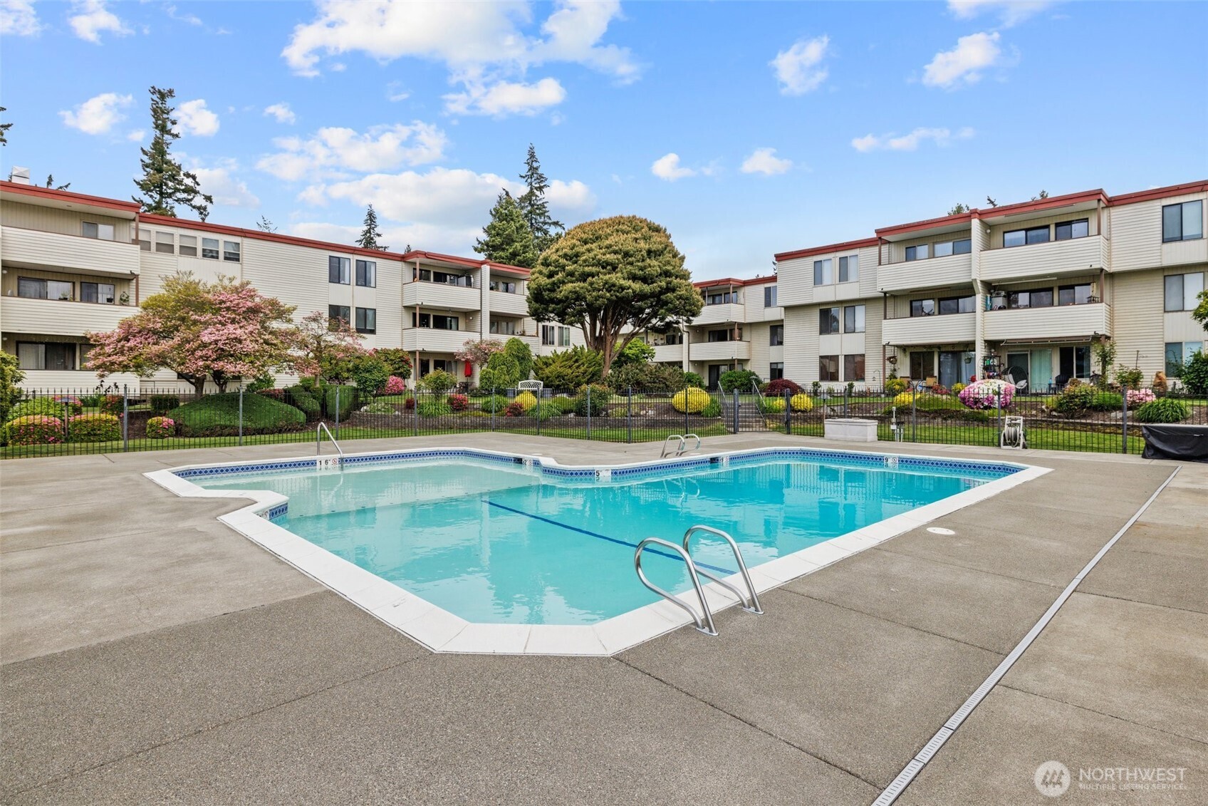 8516 196th Street Southwest, Unit 311 Edmonds, WA 98026 - Photo 23 of 28 a view of a swimming pool with outdoor seating