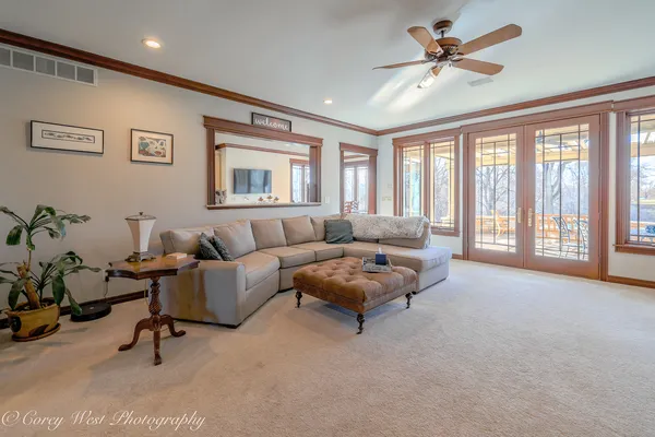 a view of a livingroom with furniture and staircase