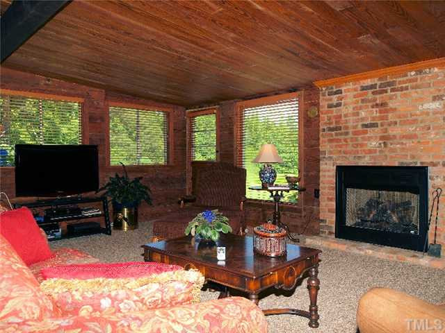 One view of the family room. Gas fireplpace and horizontal pine paneling! Den/Family/Great Room