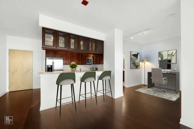 a view of a dining room with furniture and a table
