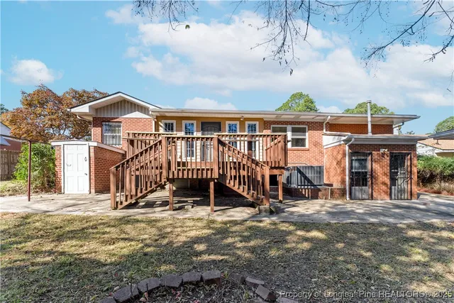 a backyard of a house with barbeque oven