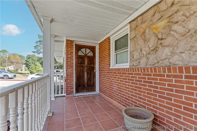 a view of a brick house with a large window