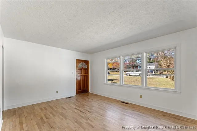 a view of an empty room with window