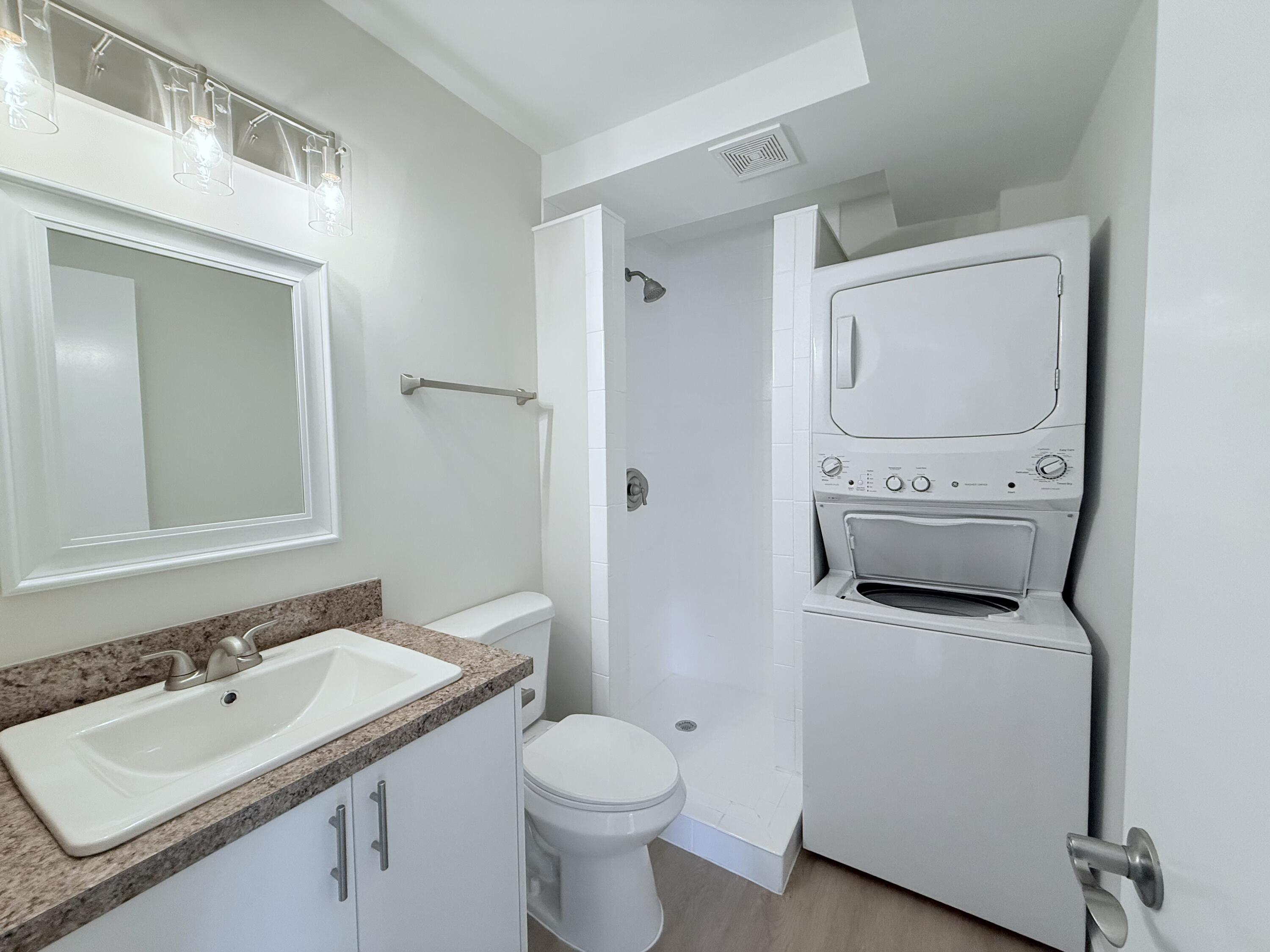 2401 Patterson Avenue, Unit 101 Key West, FL 33040 - Photo 13 of 26 a bathroom with a toilet sink and mirror