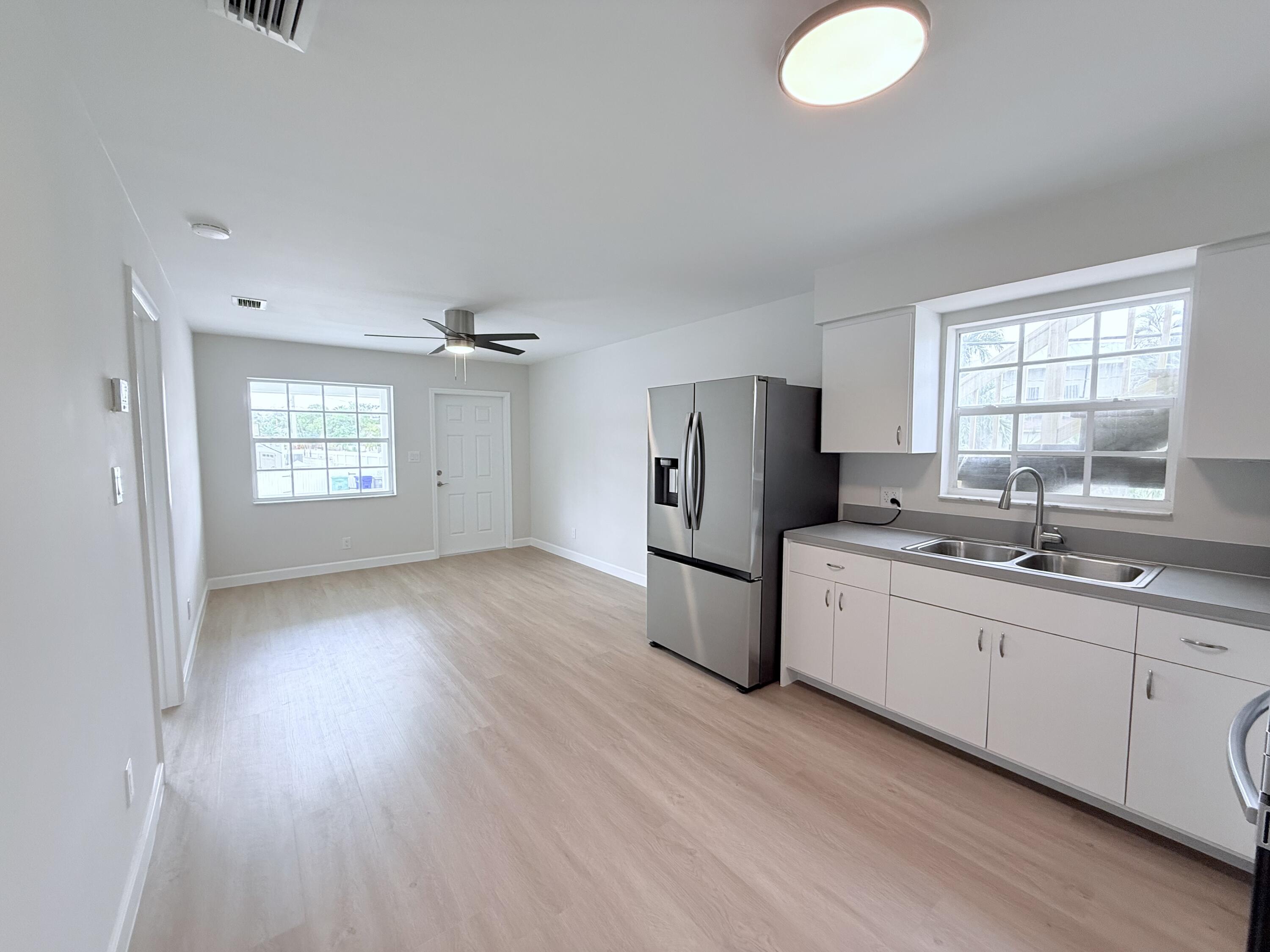 2401 Patterson Avenue, Unit 101 Key West, FL 33040 - Photo 2 of 26 a kitchen with refrigerator and window