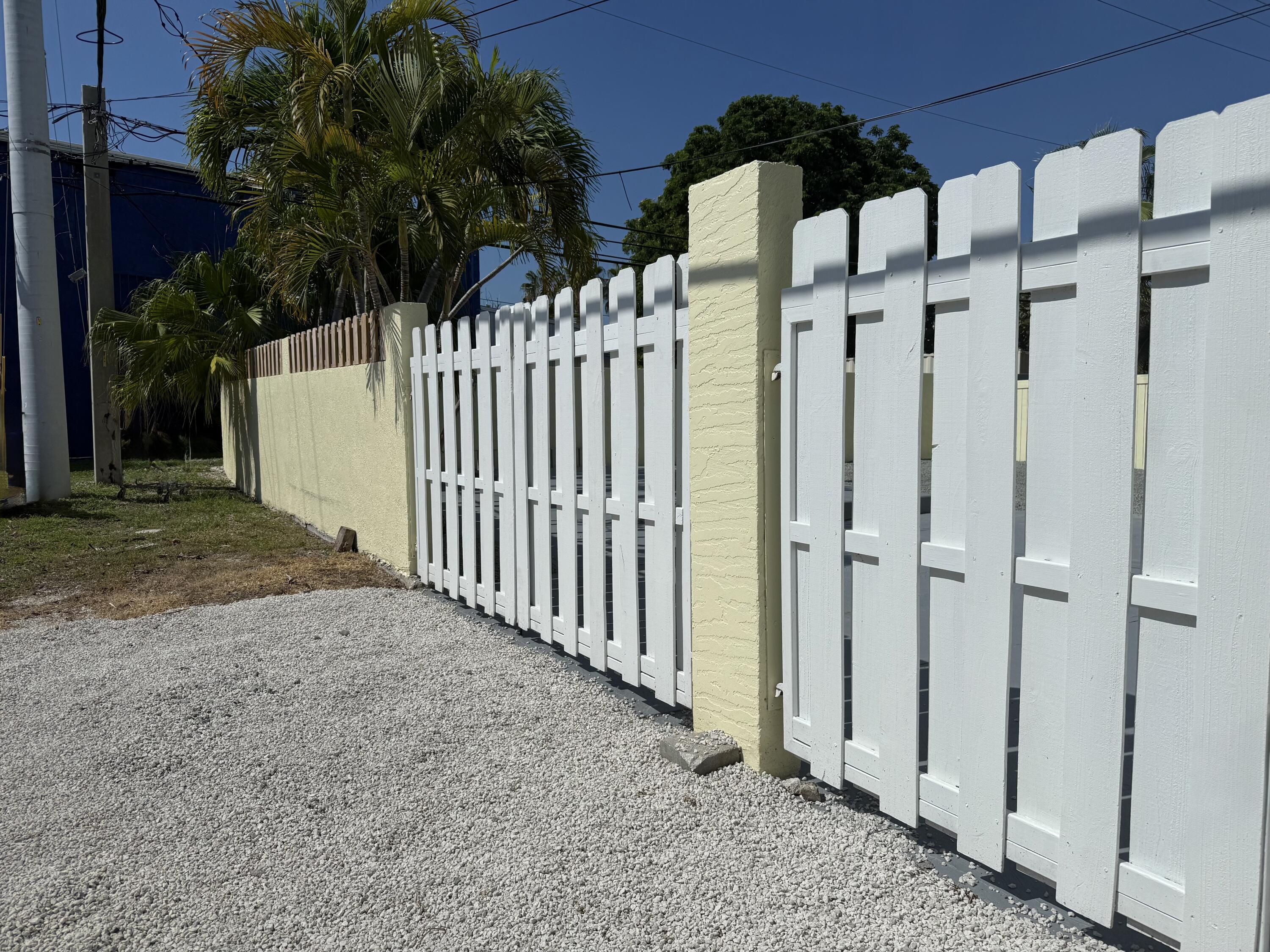 2401 Patterson Avenue, Unit 101 Key West, FL 33040 - Photo 22 of 26 a view of a wooden fence