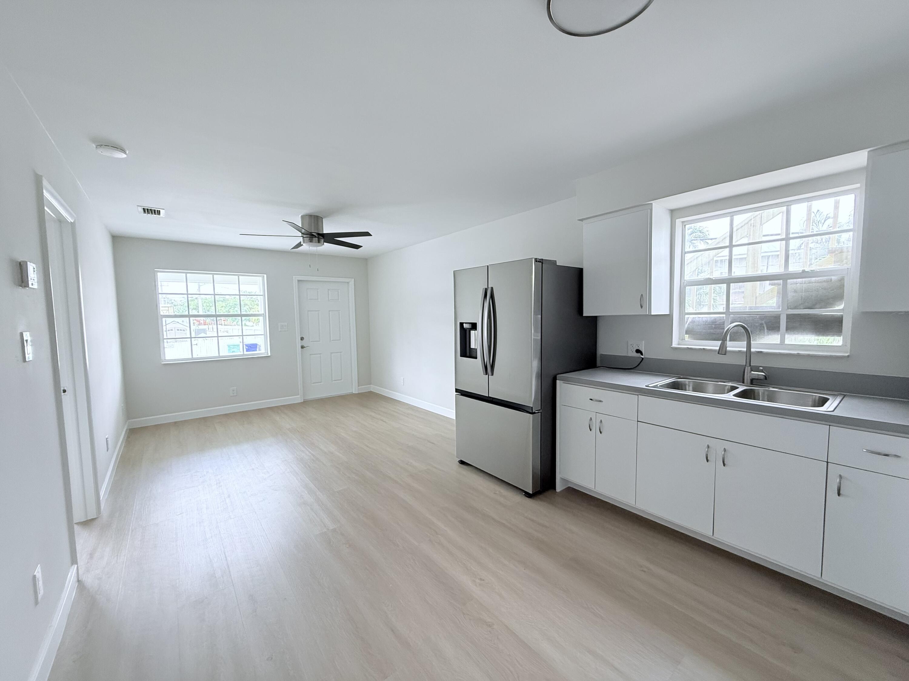 2401 Patterson Avenue, Unit 101 Key West, FL 33040 - Photo 3 of 26 a kitchen with refrigerator and window