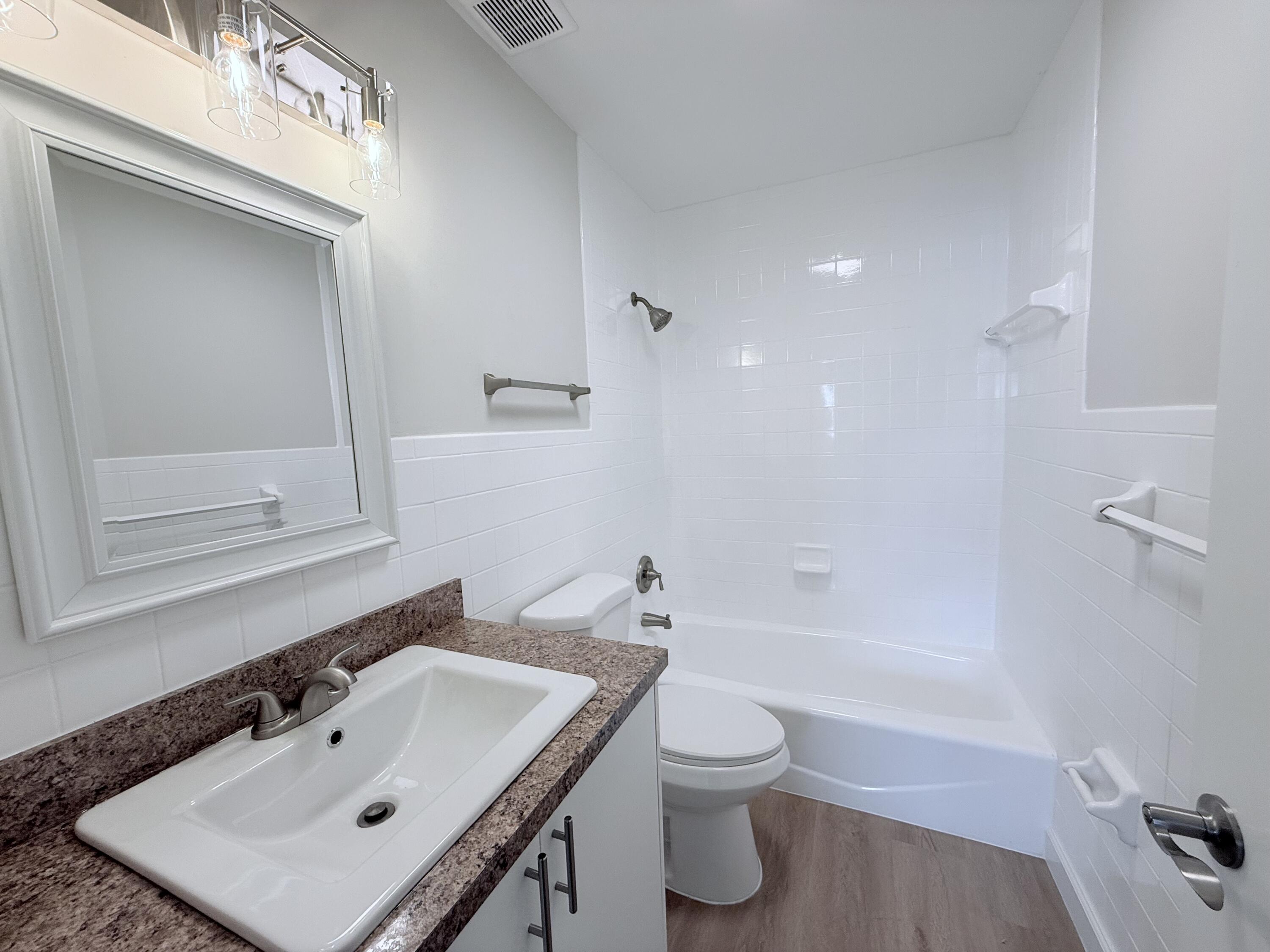 2401 Patterson Avenue, Unit 101 Key West, FL 33040 - Photo 8 of 26 a bathroom with a sink toilet and shower
