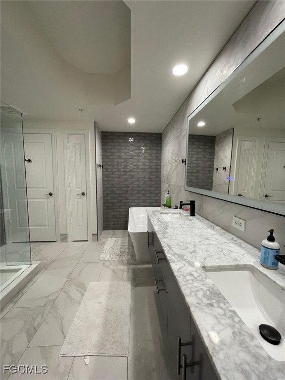 14380 Riva Del Lago Drive, Unit 1002 Fort Myers, FL 33907 - Photo 11 of 23 a large kitchen with kitchen island a sink stainless steel appliances and cabinets