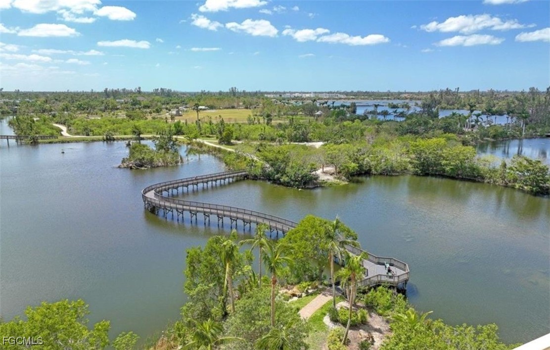 14380 Riva Del Lago Drive, Unit 1002 Fort Myers, FL 33907 - Photo 17 of 23 a view of a lake with a city
