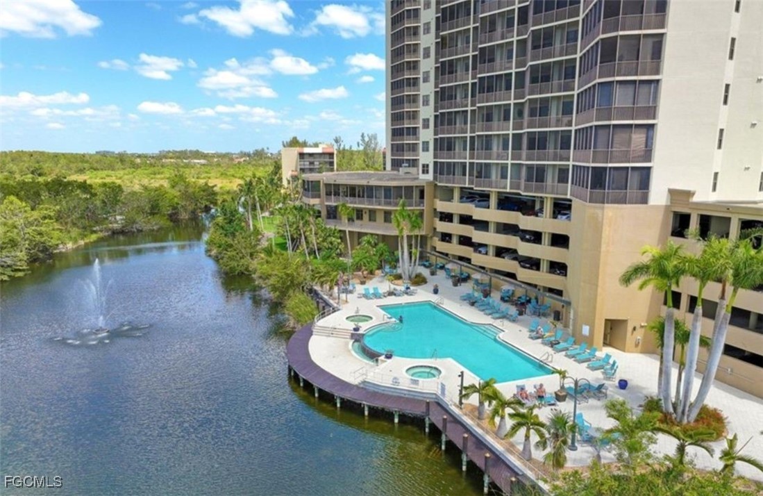 14380 Riva Del Lago Drive, Unit 1002 Fort Myers, FL 33907 - Photo 19 of 23 a balcony with chairs and a table