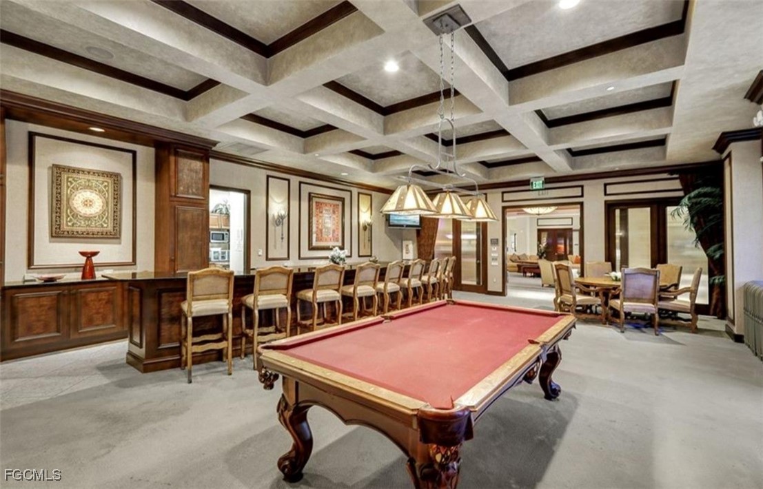 14380 Riva Del Lago Drive, Unit 1002 Fort Myers, FL 33907 - Photo 21 of 23 a room with lots of tables a large window and chairs