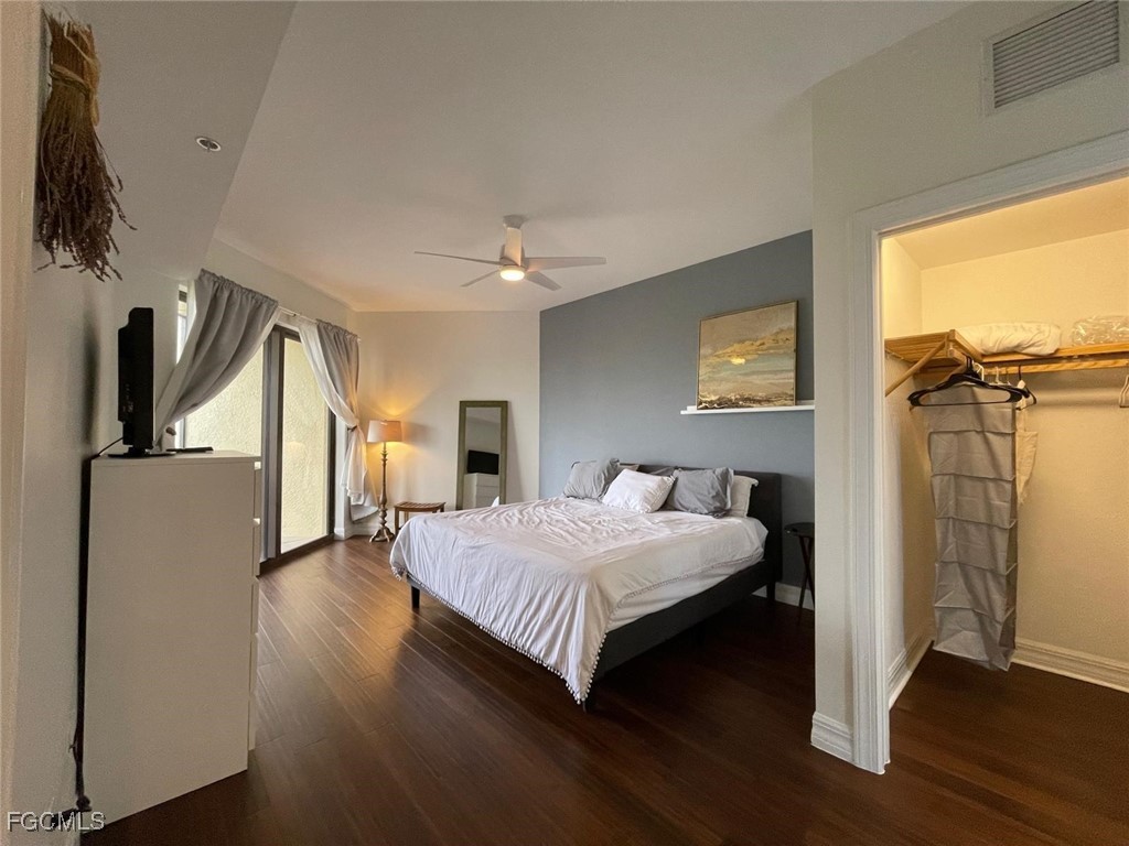 14380 Riva Del Lago Drive, Unit 1002 Fort Myers, FL 33907 - Photo 8 of 23 a bedroom with a bed and a flat screen tv