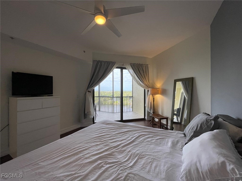 14380 Riva Del Lago Drive, Unit 1002 Fort Myers, FL 33907 - Photo 9 of 23 a view of a bedroom with a bed and a tv