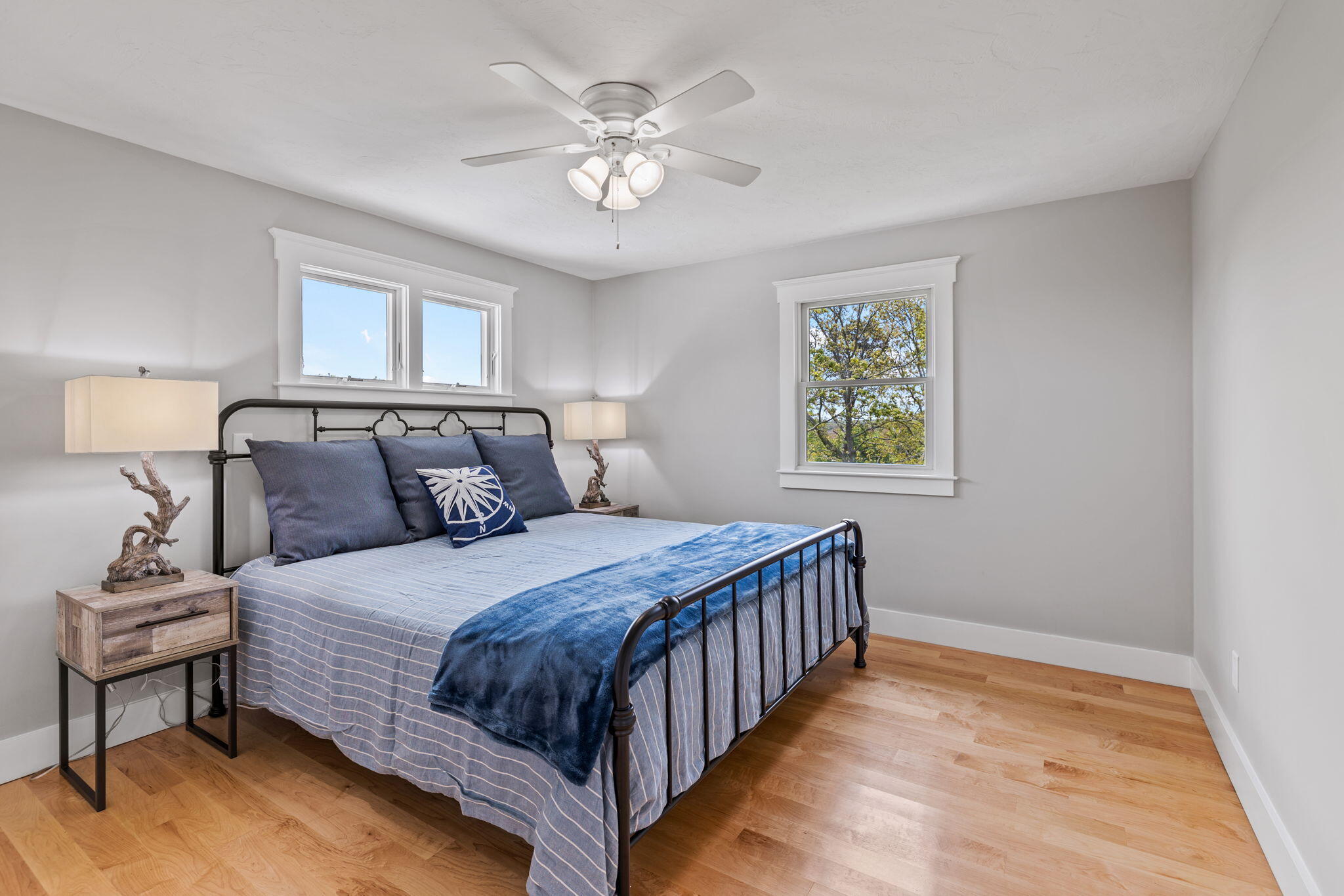 40 Pilgrim Road Sagamore Beach, MA 02562 - Photo 21 of 42 a bedroom with a bed and a chandelier