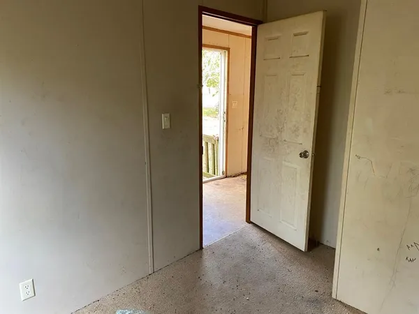 a view of an empty room and window