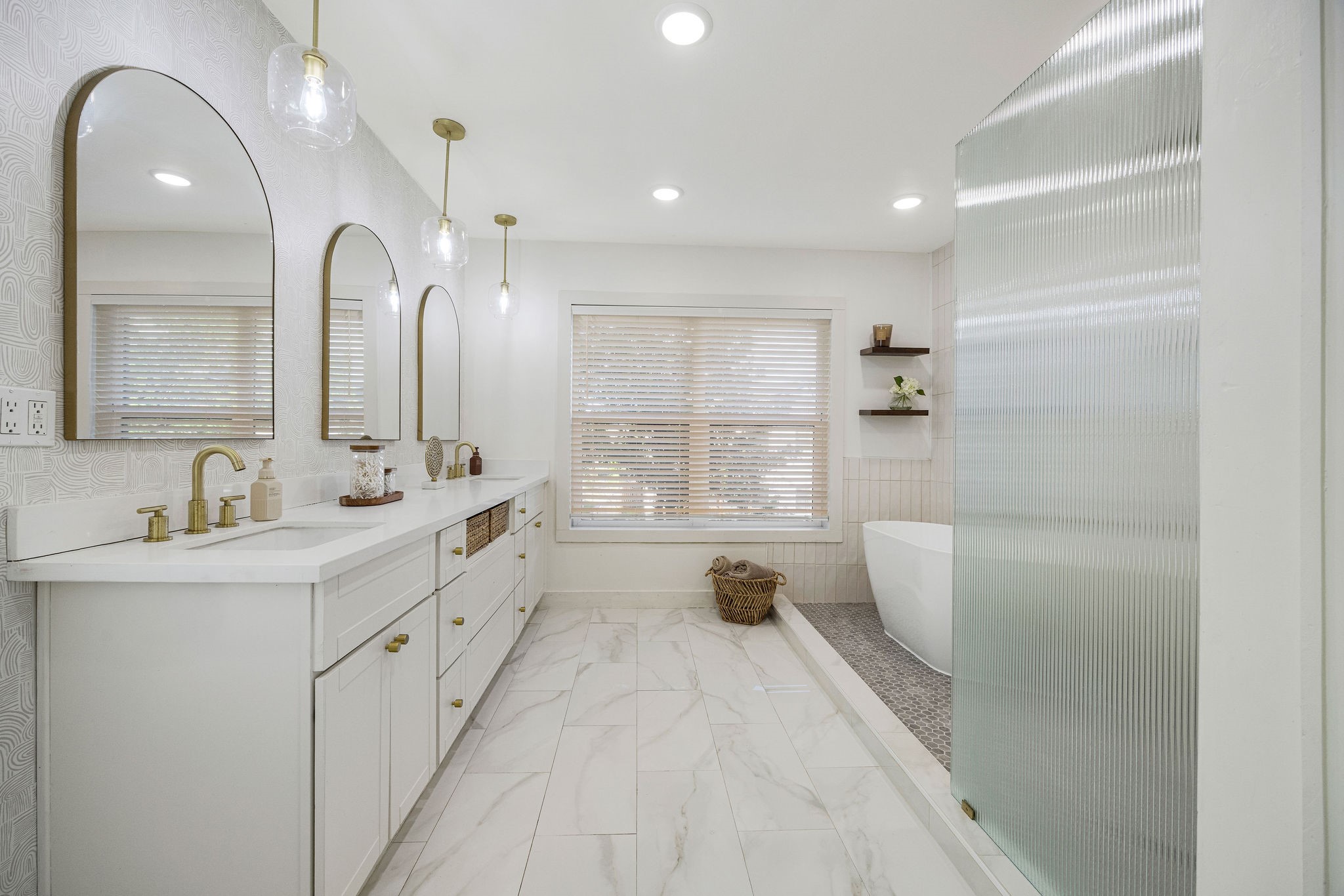 2613 Wichita Street Houston, TX 77004 - Photo 19 of 25 Luxurious primary bath retreat with a freestanding soaking tub, oversized walk-in shower, and elegant modern finishes.