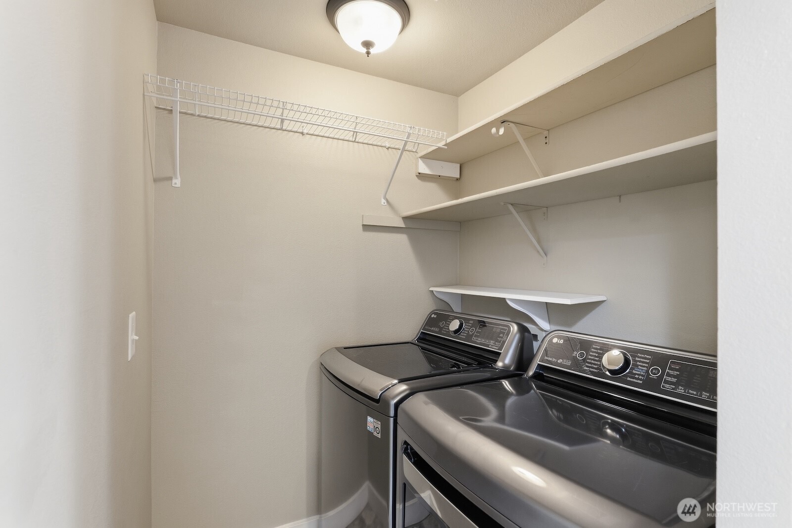 16409 Currie Road Southeast, Unit A308 Monroe, WA 98272 - Photo 14 of 21 a view of a room with racks on the wall