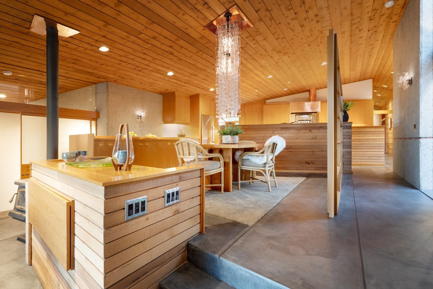 26225 Rinconada Drive Carmel Valley, CA 93924 - Photo 15 of 44 a view of living room with granite countertop furniture and a fireplace