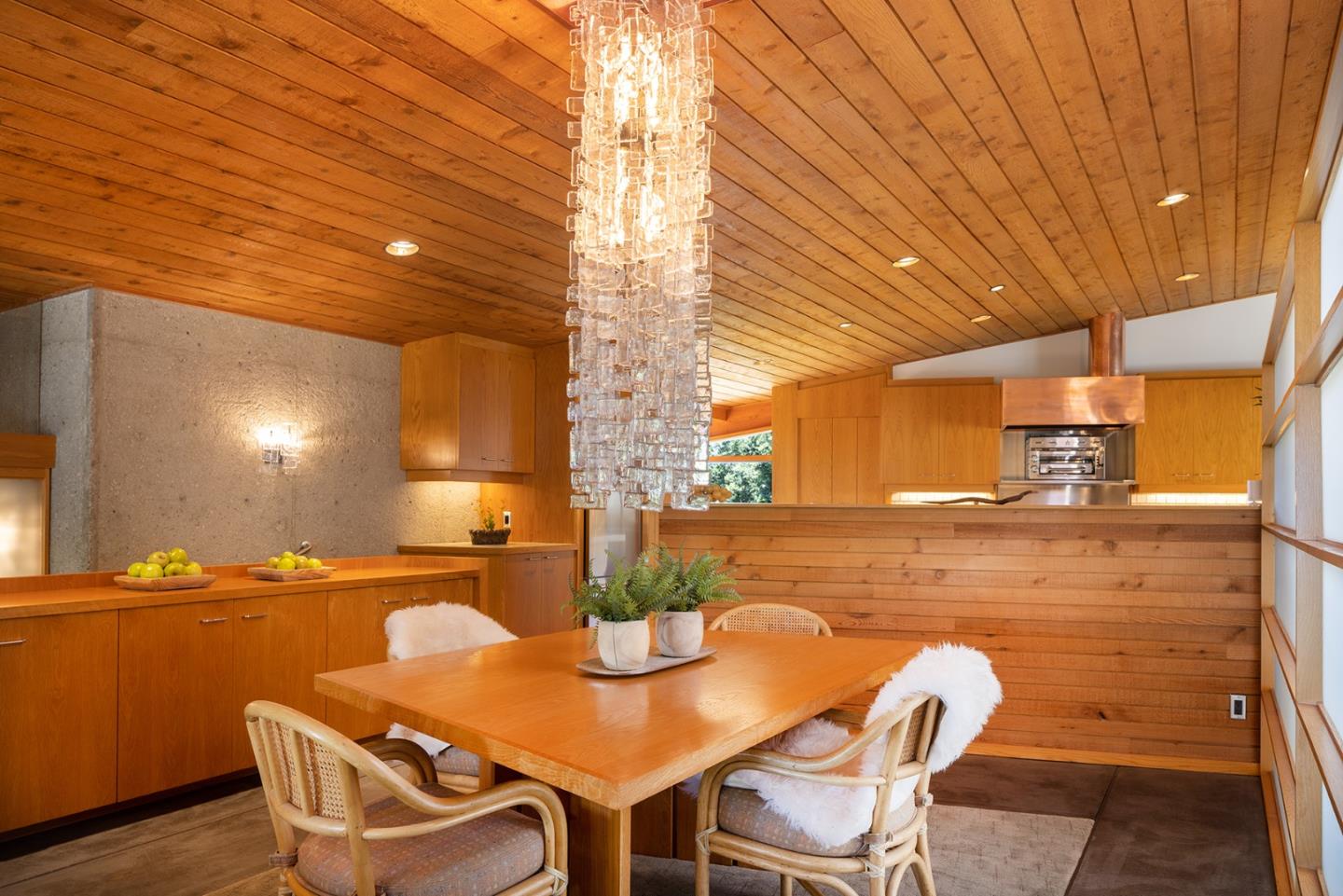 26225 Rinconada Drive Carmel Valley, CA 93924 - Photo 16 of 44 a view of a dining room with furniture and wooden floor