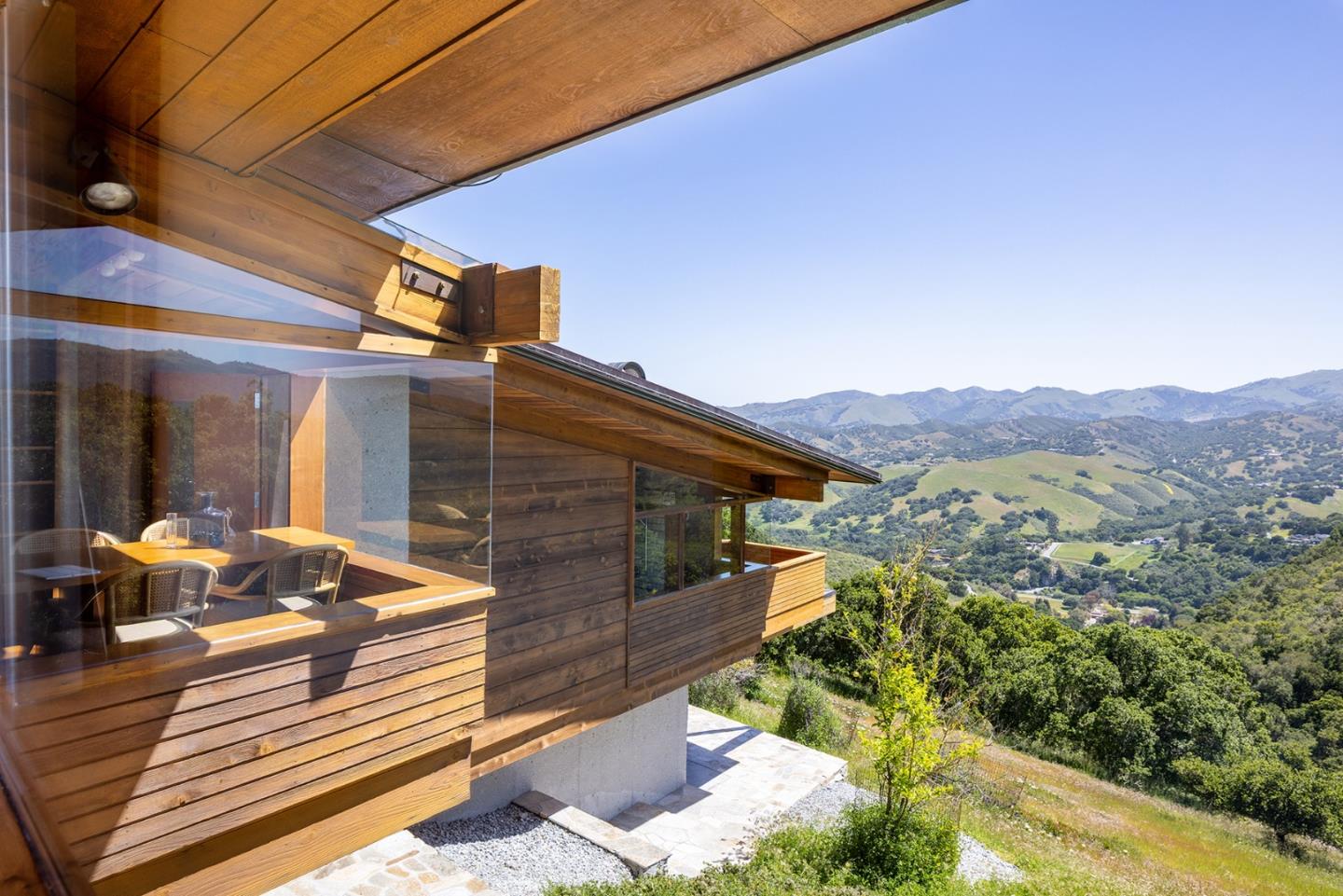 26225 Rinconada Drive Carmel Valley, CA 93924 - Photo 28 of 44 a outdoor view of a house with a patio