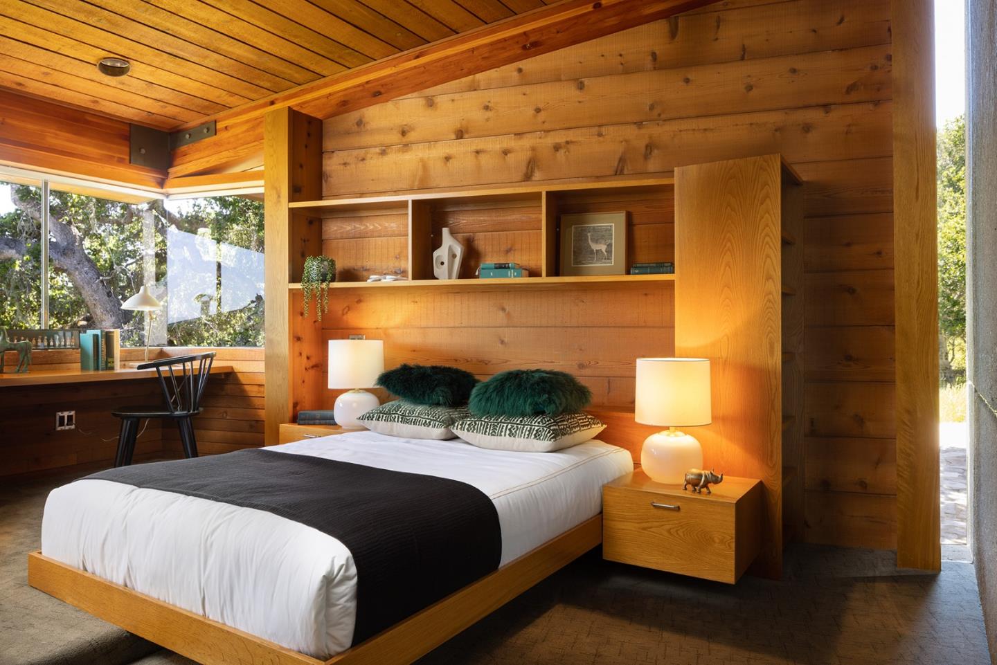 26225 Rinconada Drive Carmel Valley, CA 93924 - Photo 33 of 44 a bedroom with a bed and a night stand