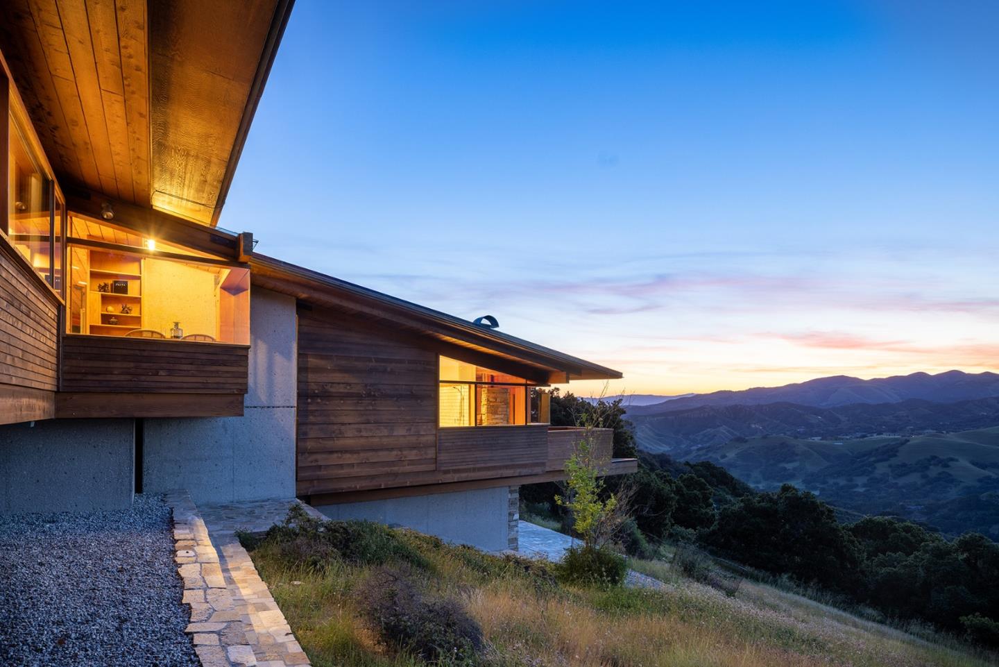 26225 Rinconada Drive Carmel Valley, CA 93924 - Photo 39 of 44 a view of a house with a yard