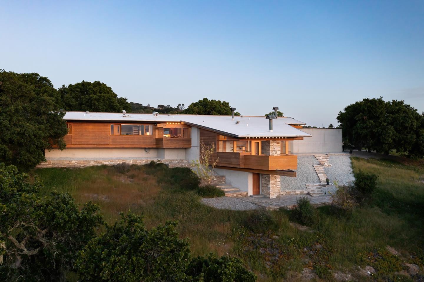26225 Rinconada Drive Carmel Valley, CA 93924 - Photo 41 of 44 a view of a house with a yard