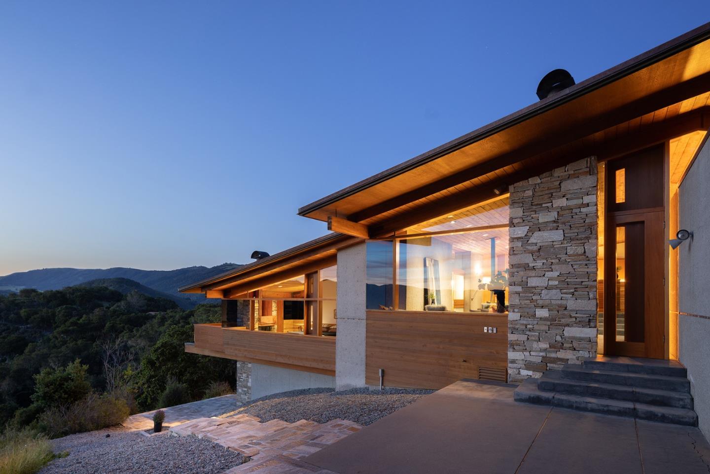 26225 Rinconada Drive Carmel Valley, CA 93924 - Photo 42 of 44 a front view of a house with a yard