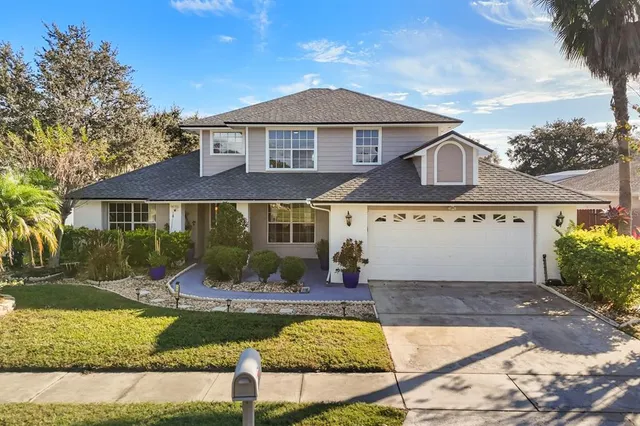 front view of a house with a yard