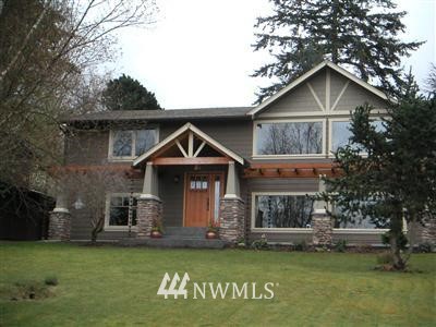 240 Bayside Road Bellingham, WA 98225 - Photo 1 of 1 a front view of a house with a garden and plants