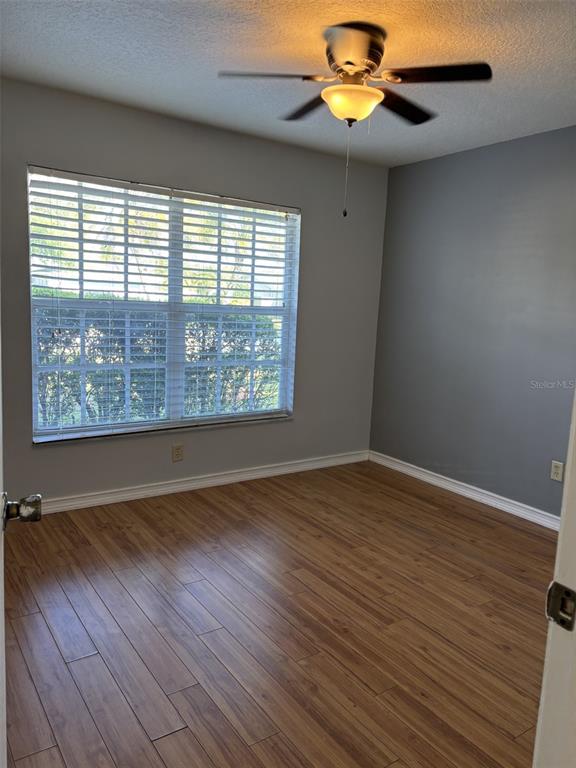 1927 Cheney Court Lutz, FL 33549 - Photo 15 of 20 a view of a livingroom with wooden floor and a large window