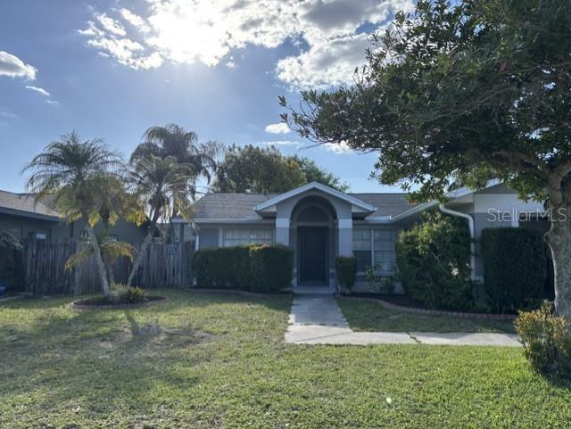 1927 Cheney Court Lutz, FL 33549 - Photo 2 of 20 a front view of a house with garden
