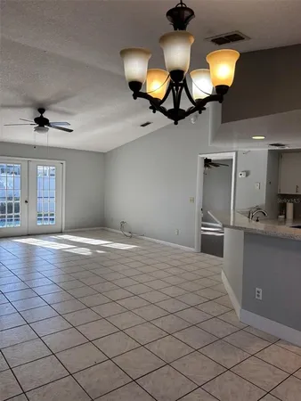 a kitchen with stainless steel appliances granite countertop a sink a stove and a microwave