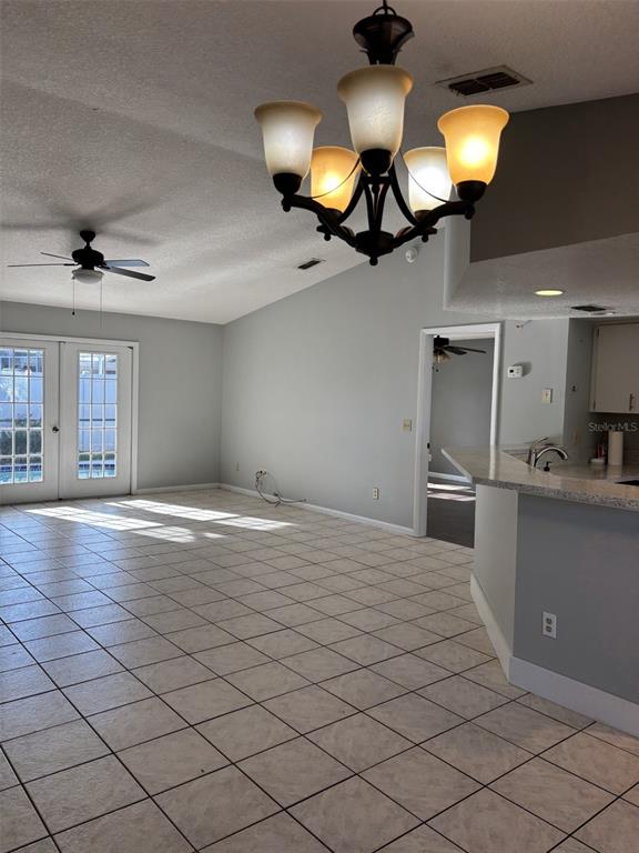 1927 Cheney Court Lutz, FL 33549 - Photo 5 of 20 a kitchen with stainless steel appliances granite countertop a sink a stove and a microwave