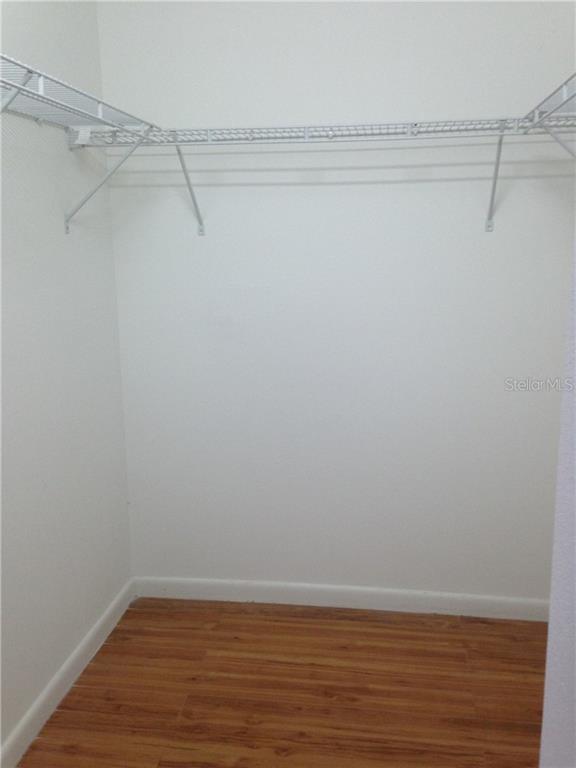 1927 Cheney Court Lutz, FL 33549 - Photo 9 of 20 a view of a room with racks on the wall