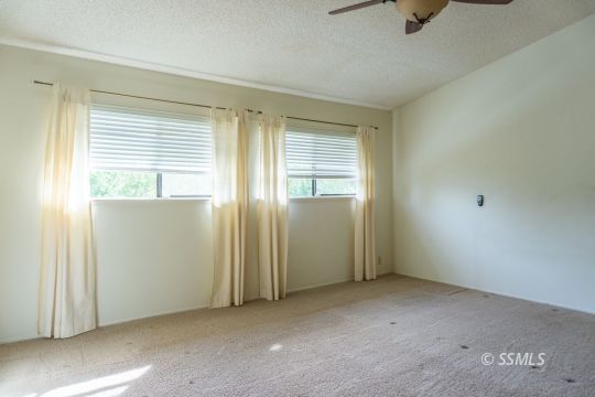 924 Scott Street Ridgecrest, CA 93555 - Photo 19 of 26 a view of an empty room with a window