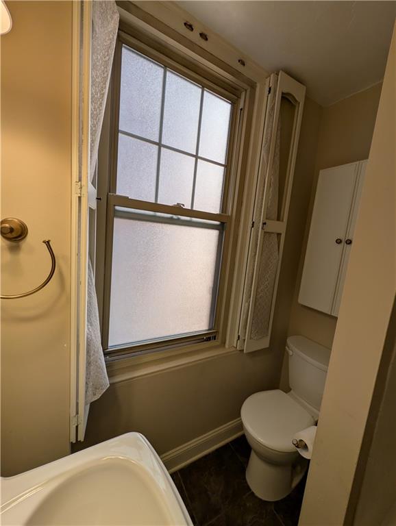 144 North Dithridge Street, Unit 403 Pittsburgh, PA 15213 - Photo 15 of 31 a bathroom with a toilet sink and a mirror