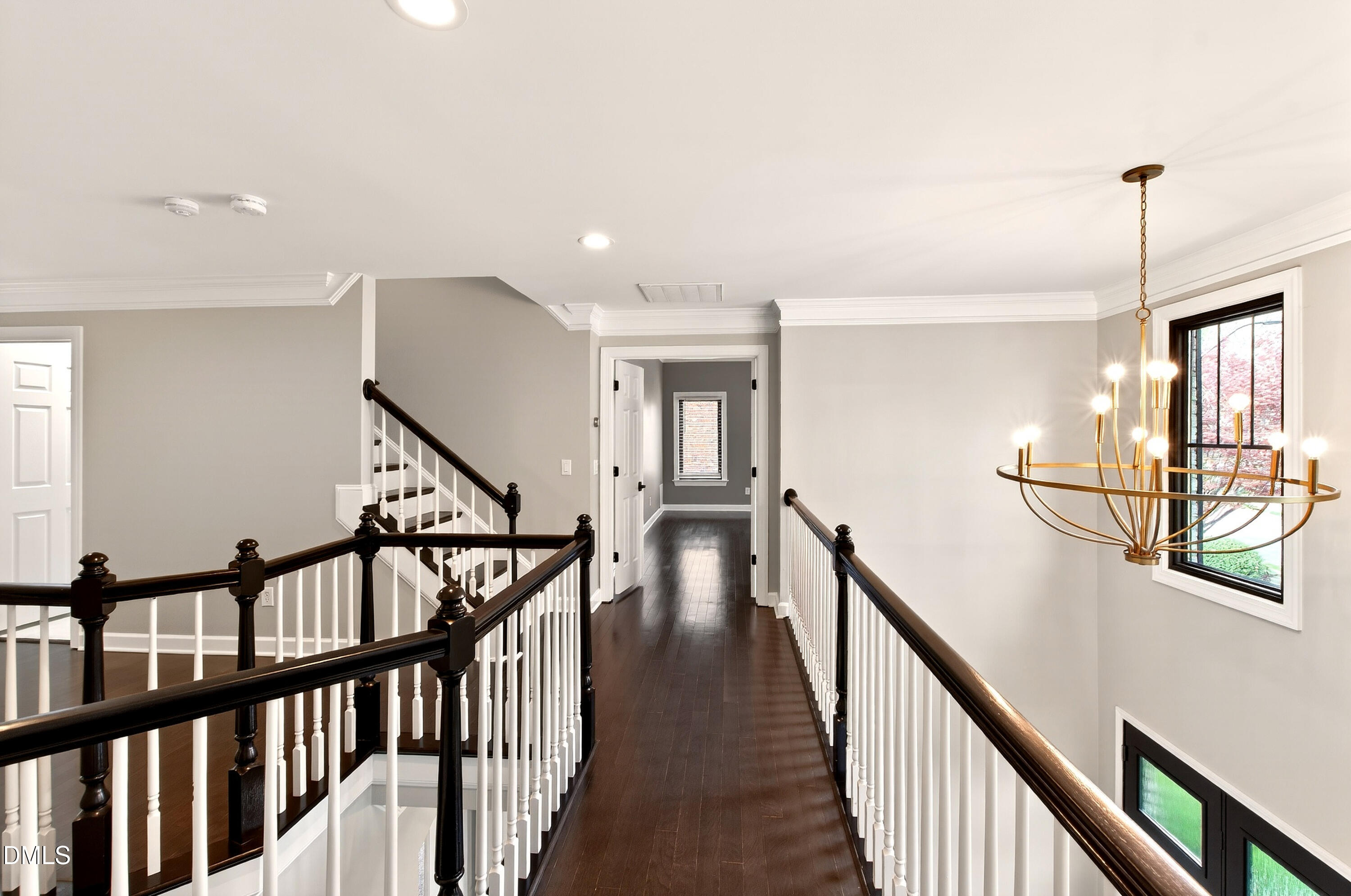 12408 Cilcain Court Raleigh, NC 27614 - Photo 41 of 80 a view of staircase with lots of frames on wall and wooden floor