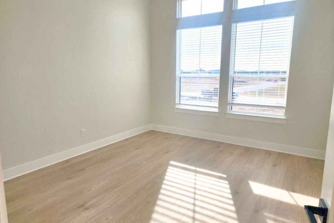 1400 Paxton Lane Georgetown, TX 78633 - Photo 2 of 39 Unfurnished room with baseboards and light wood finished floors