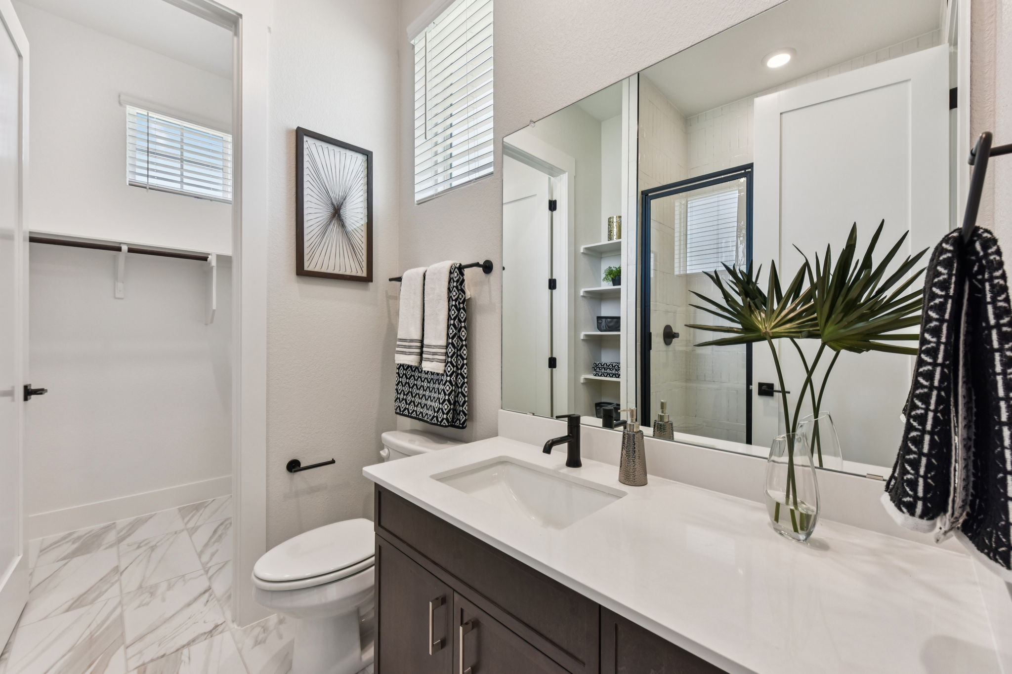 1400 Paxton Lane Georgetown, TX 78633 - Photo 21 of 39 Full bathroom with vanity, a spacious closet, light marble finish flooring, and a shower with door