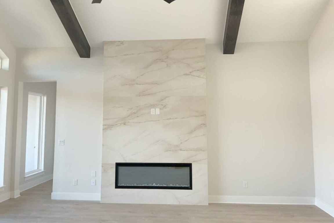 1400 Paxton Lane Georgetown, TX 78633 - Photo 7 of 39 Detailed view of beamed ceiling, a premium fireplace, and wood finished floors