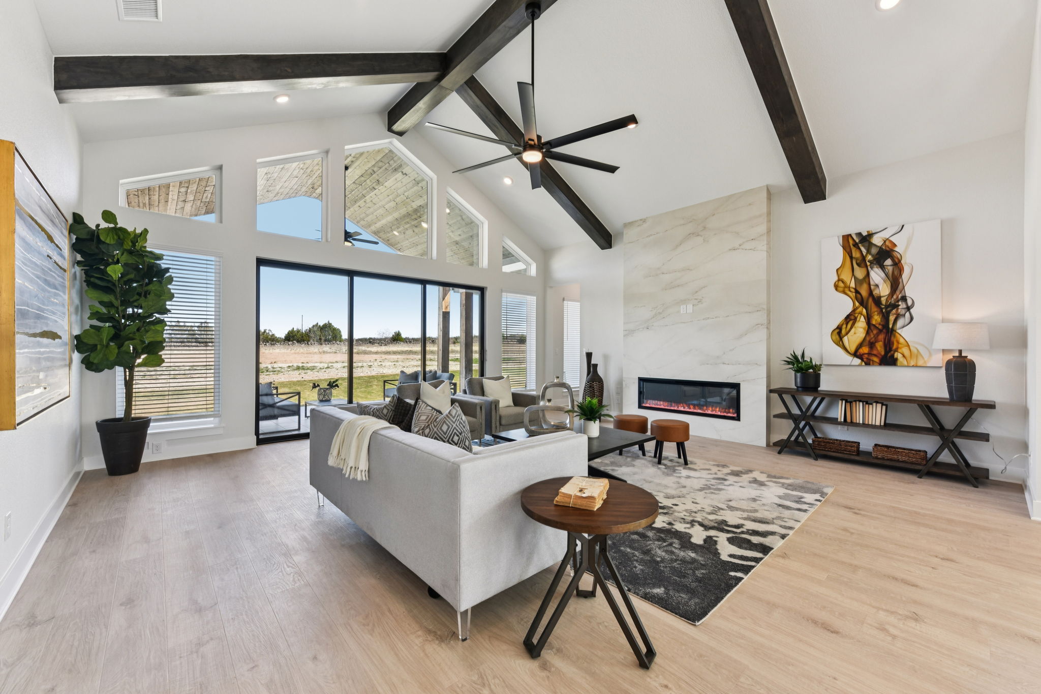 1400 Paxton Lane Georgetown, TX 78633 - Photo 8 of 39 Living room featuring light wood finished floors, a high end fireplace, and a ceiling fan