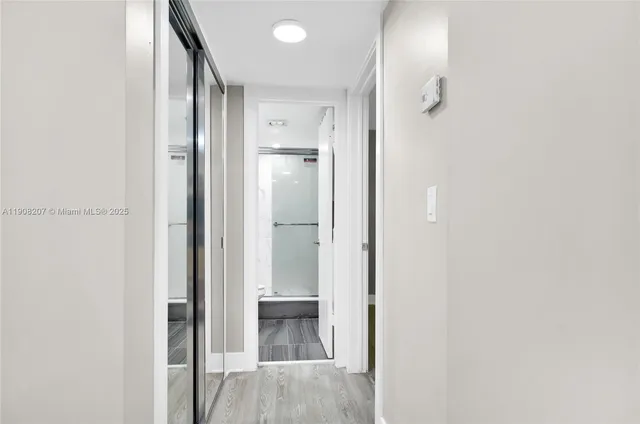 a view of bathroom with a shower and a sink